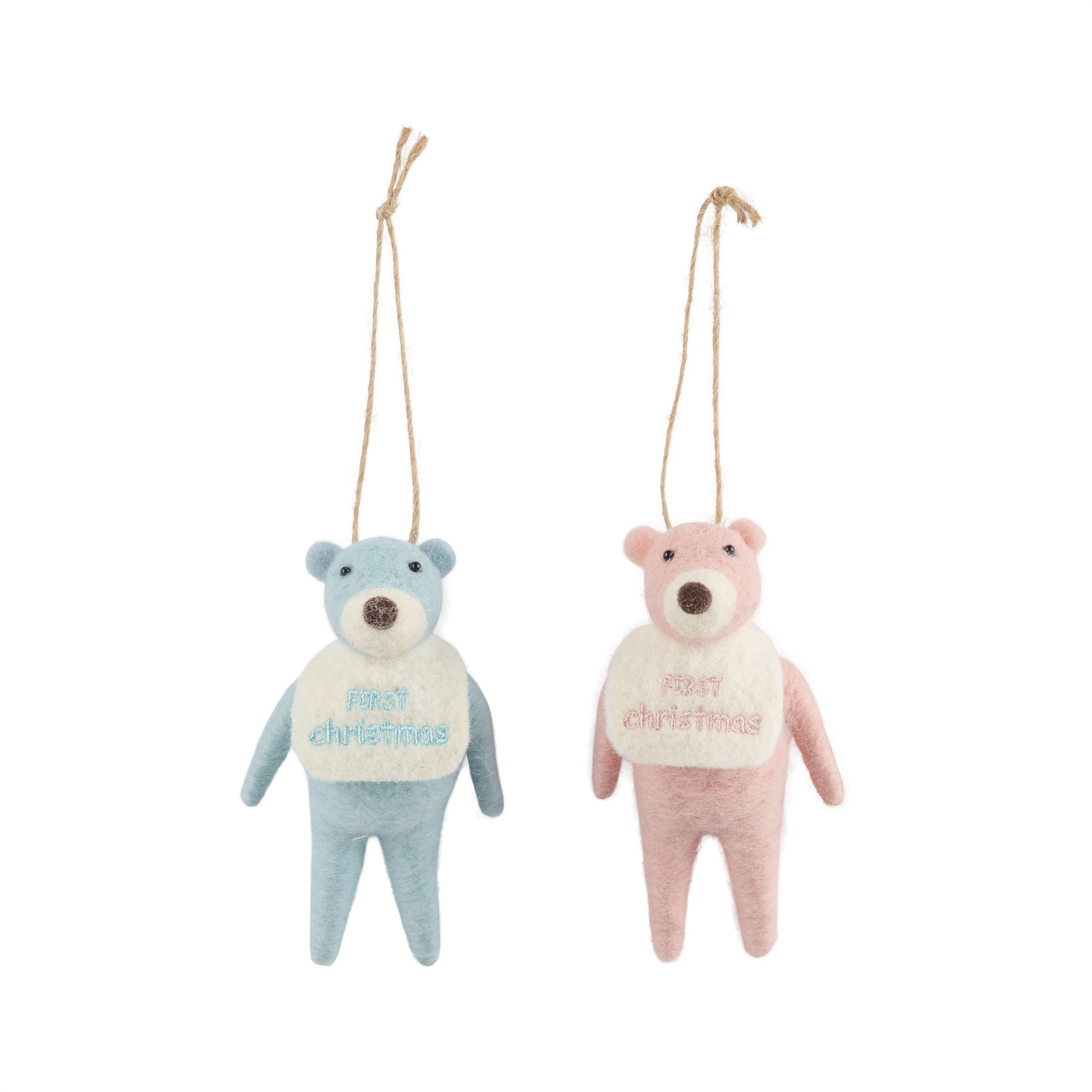 teddy bear ornaments, one blue and one pink, with 'first christmas' sweaters on a white background.