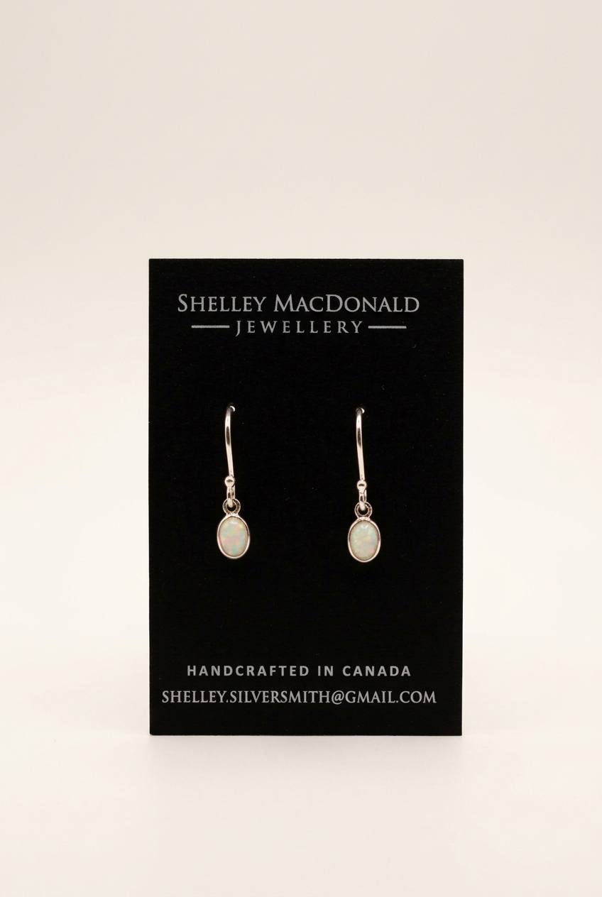 Small Oval Opal Dangle Earrings with a cleaner background